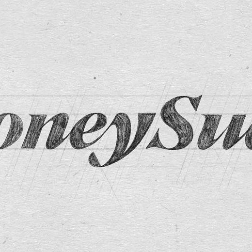 Petal-like detail in the hand-drawn Y of the new Honey Suckle masthead
